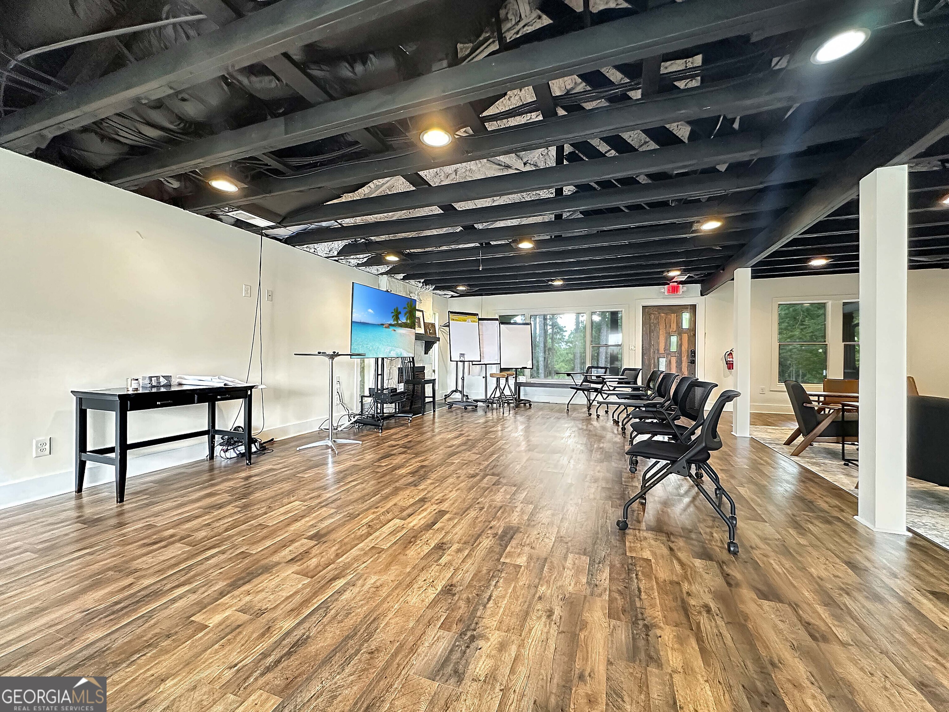 8400 Atlanta Newnan Road Chattahoochee Hills, GA 30268 - Photo 15 of 30 a view of a hall with wooden floor