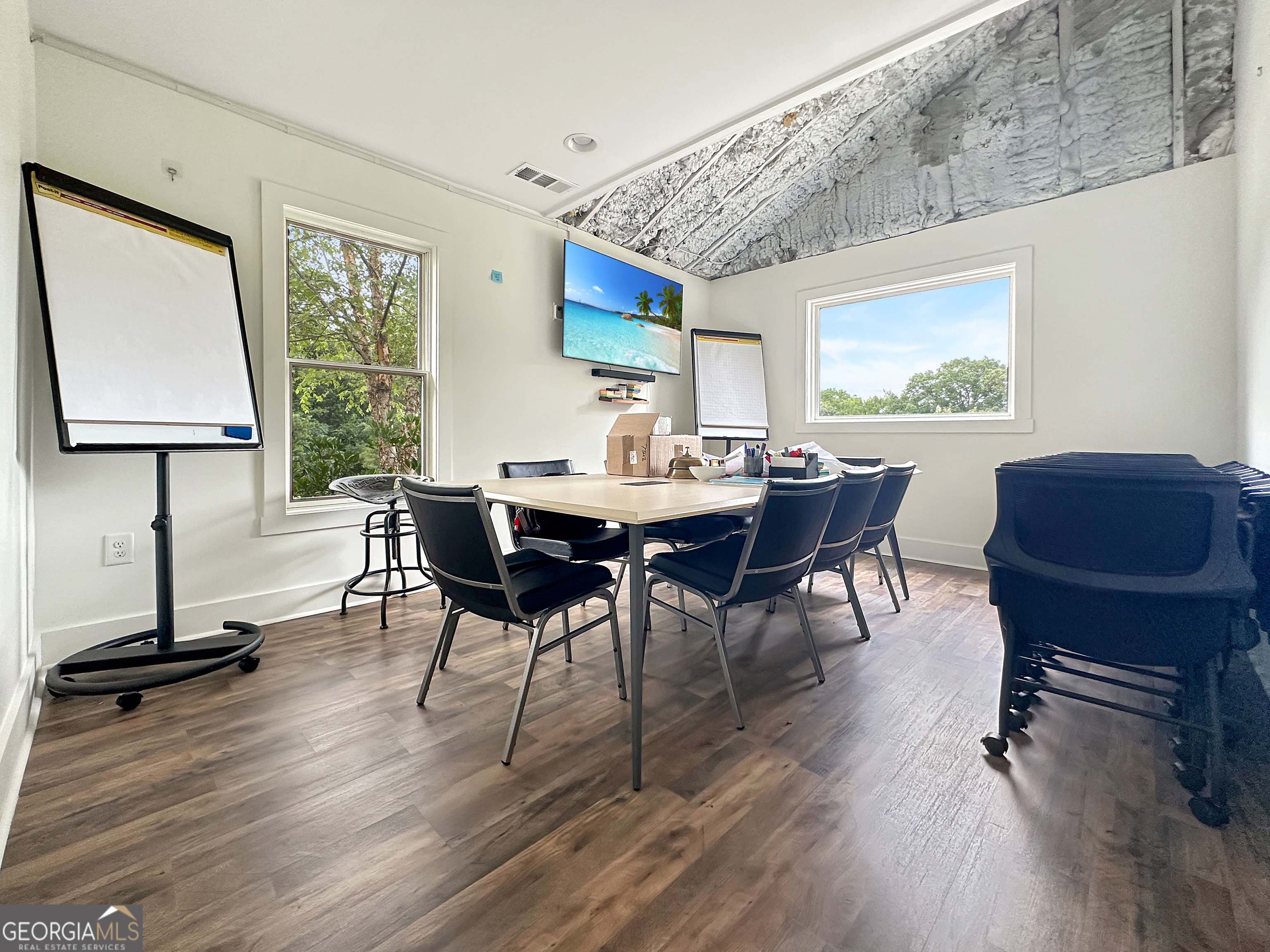 8400 Atlanta Newnan Road Chattahoochee Hills, GA 30268 - Photo 21 of 30 a view of a dining room with furniture window and wooden floor