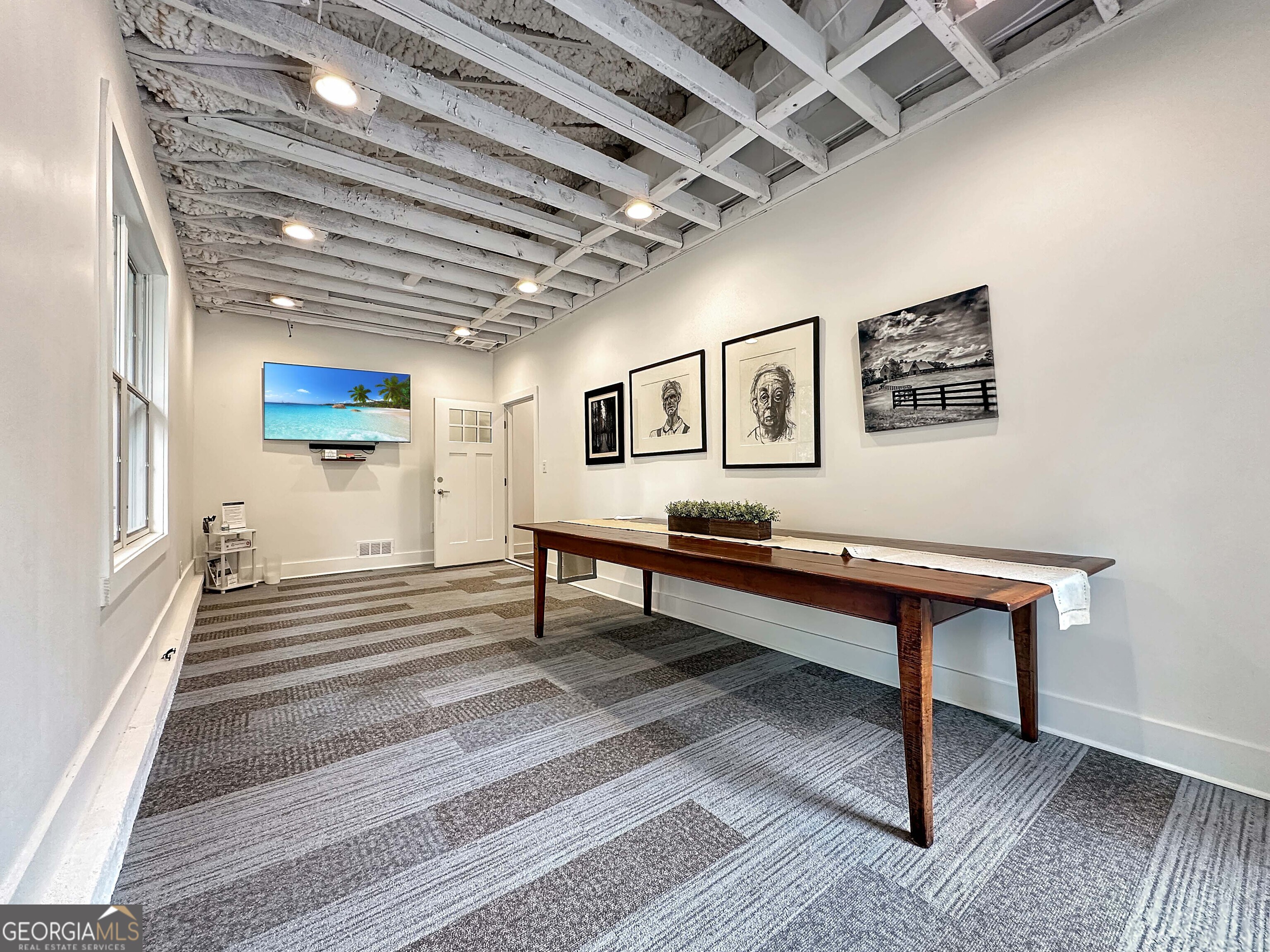 8400 Atlanta Newnan Road Chattahoochee Hills, GA 30268 - Photo 24 of 30 a reading room with wooden benches
