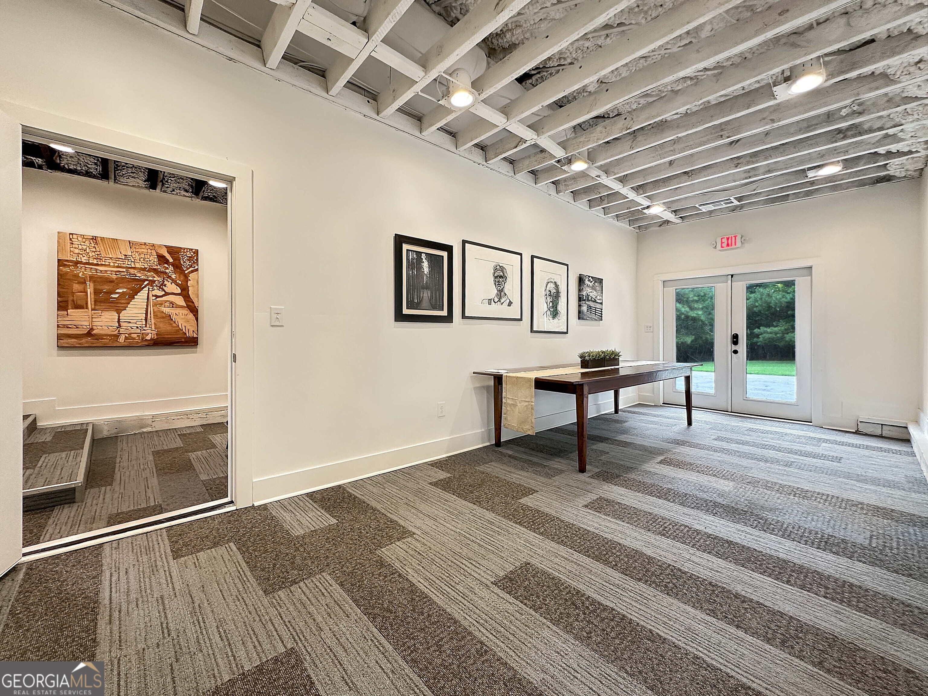 8400 Atlanta Newnan Road Chattahoochee Hills, GA 30268 - Photo 25 of 30 a view of a hallway with wooden floor and a cabinet