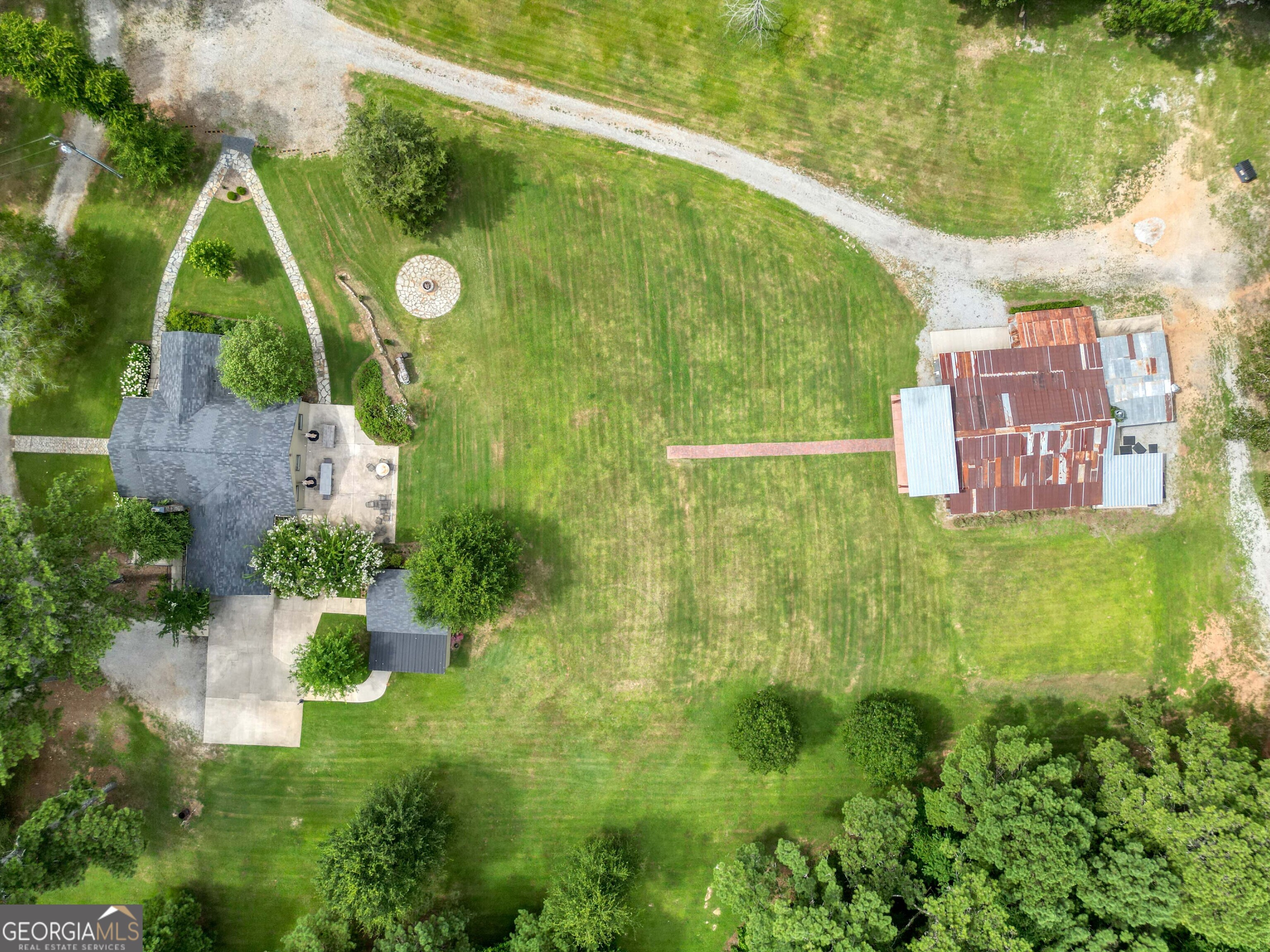 8400 Atlanta Newnan Road Chattahoochee Hills, GA 30268 - Photo 4 of 30 a view of a back yard