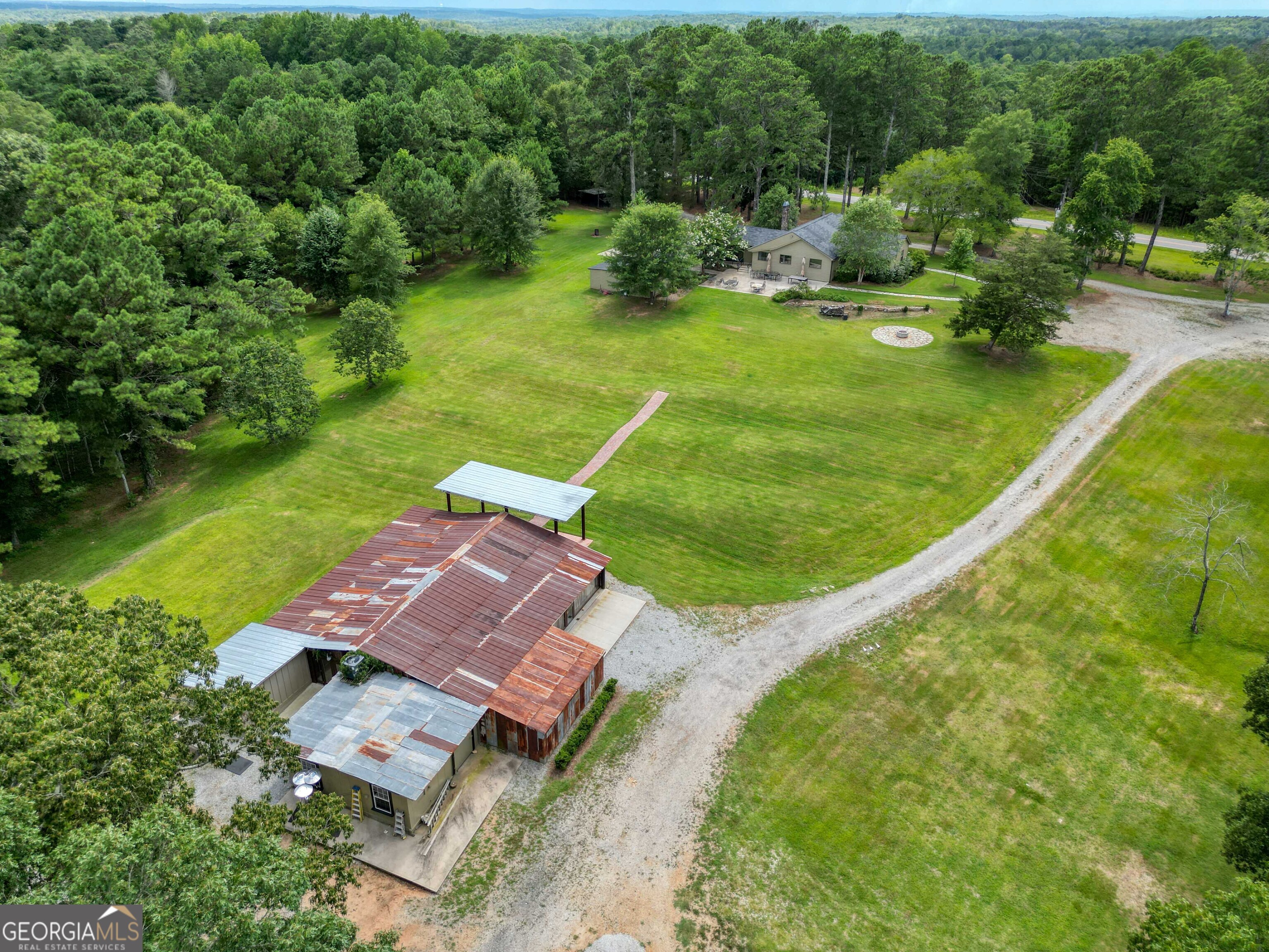 8400 Atlanta Newnan Road Chattahoochee Hills, GA 30268 - Photo 5 of 30 an aerial view of a house with outdoor space lake view and mountain view