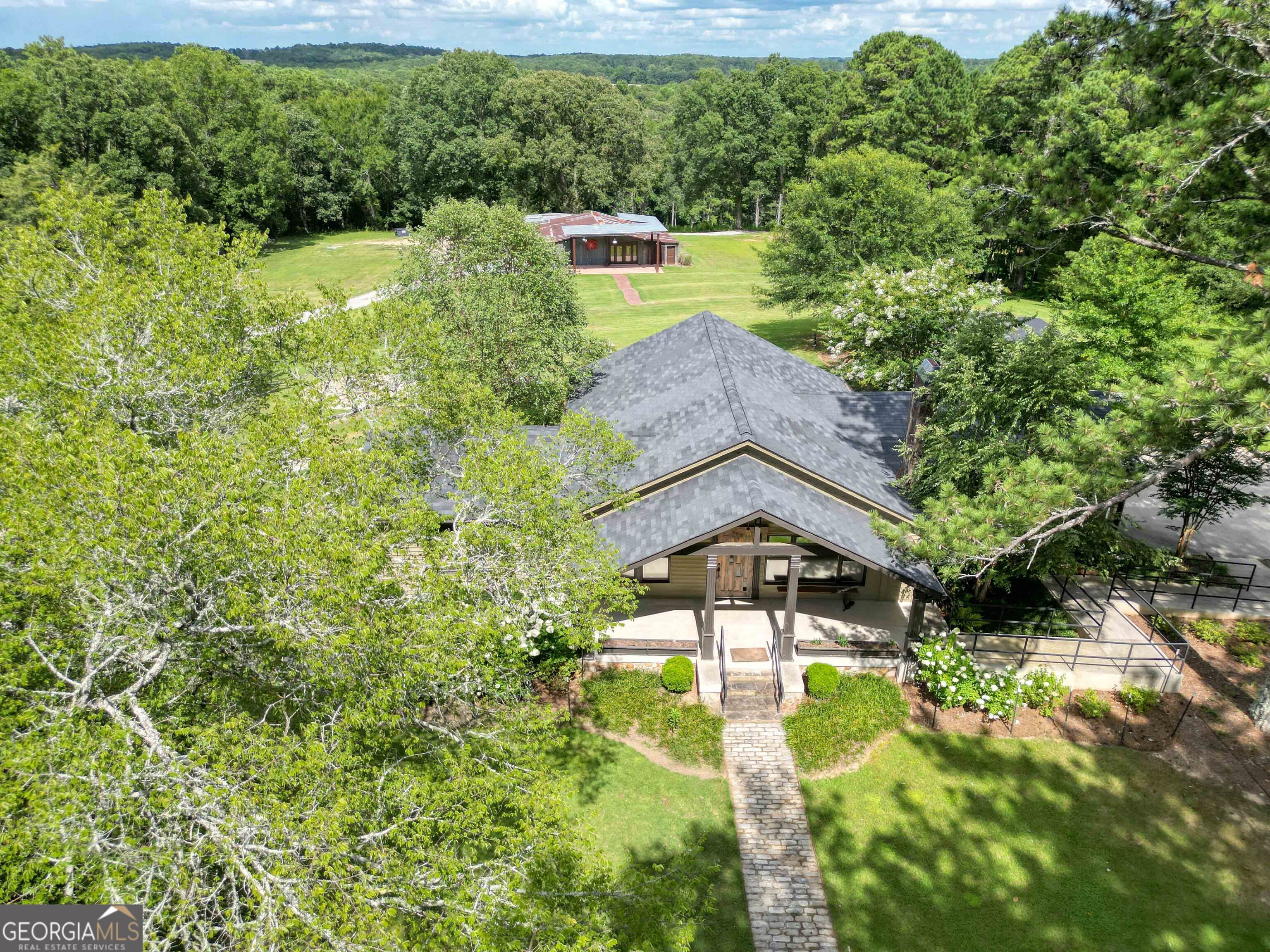 8400 Atlanta Newnan Road Chattahoochee Hills, GA 30268 - Photo 8 of 30 a picture of street view with a yard