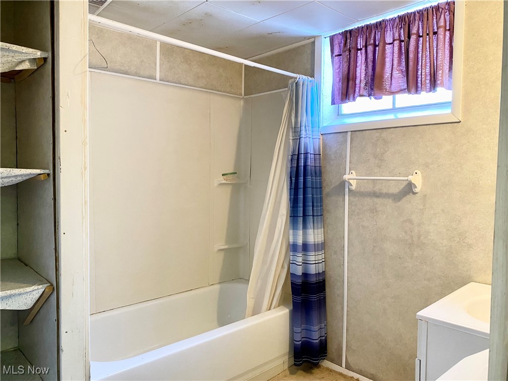 1034 Straub Road West Mansfield, OH 44904 - Photo 19 of 27 Bathroom with vanity and shower / tub combo with curtain