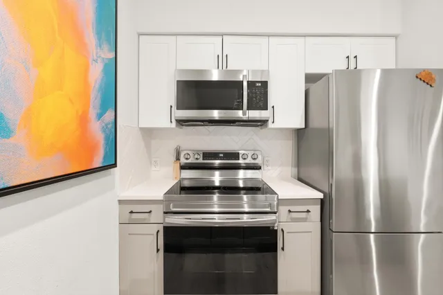 a kitchen with a stove and a microwave