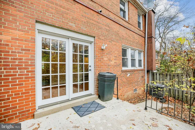 a view of a brick house with a large window