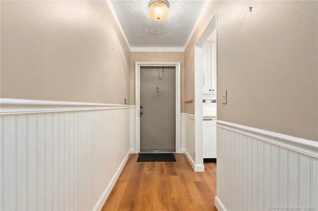 a bathroom with a granite countertop toilet sink and mirror