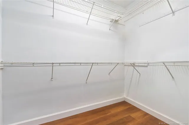 a view of a swimming pool with a yard and a fountain