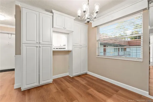 a view of a hallway with stairs