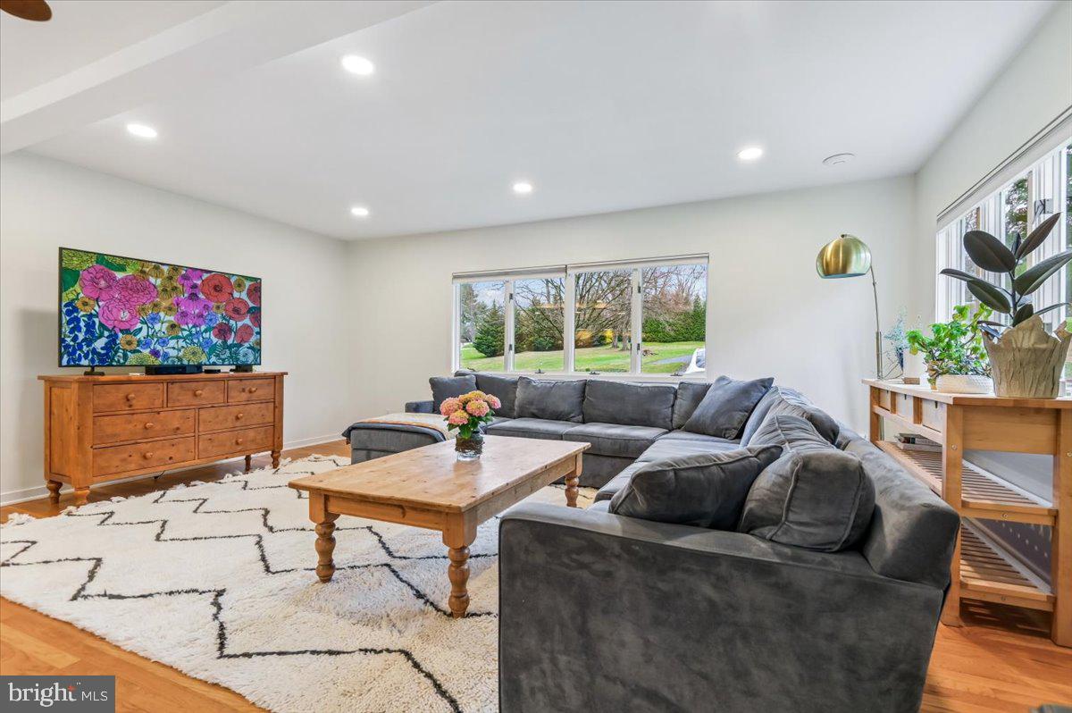 308 West Wind Road Towson, MD 21204 - Photo 10 of 80 a living room with furniture and a flat screen tv