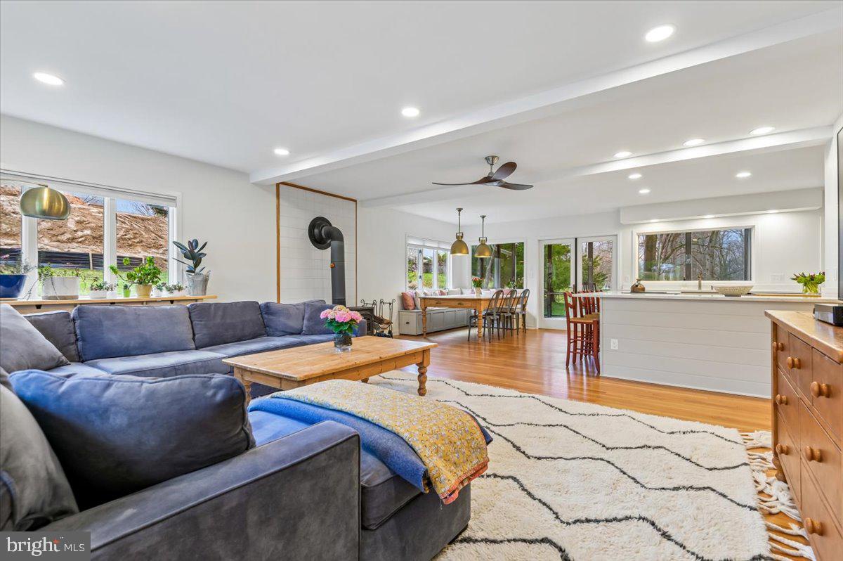 308 West Wind Road Towson, MD 21204 - Photo 11 of 80 a living room with furniture and a dining table with kitchen view