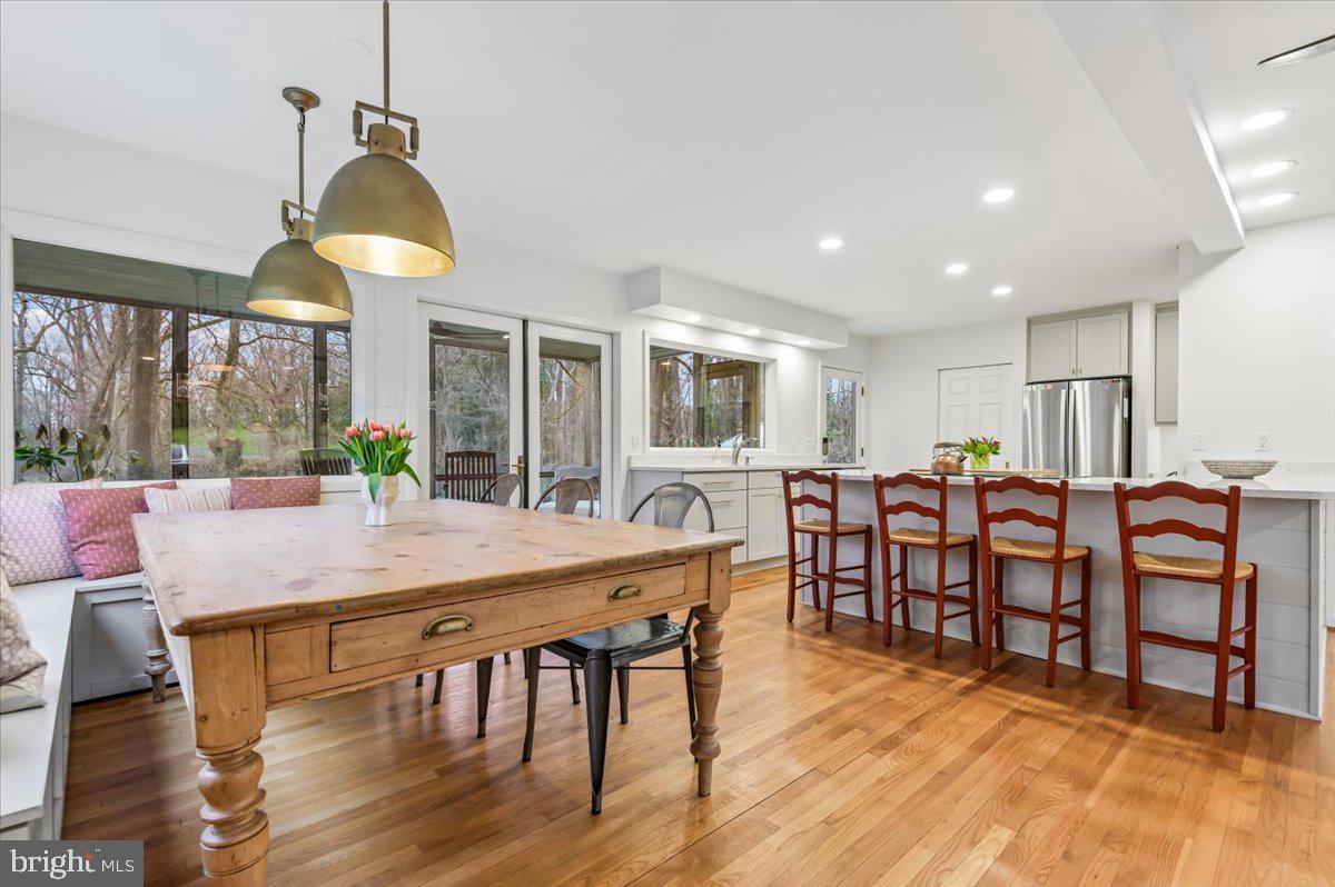308 West Wind Road Towson, MD 21204 - Photo 14 of 80 a view of a dining room with furniture window and wooden floor