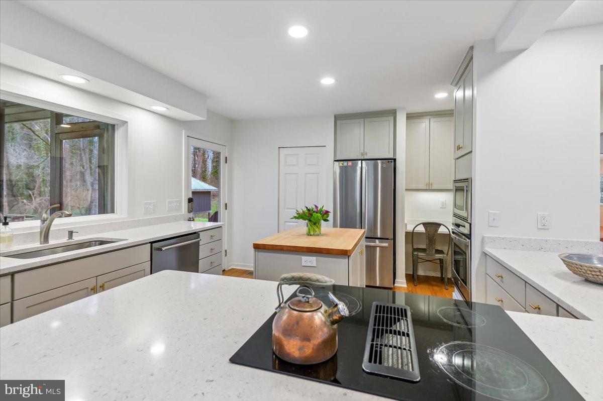 308 West Wind Road Towson, MD 21204 - Photo 18 of 80 a kitchen with stainless steel appliances granite countertop a sink and a refrigerator