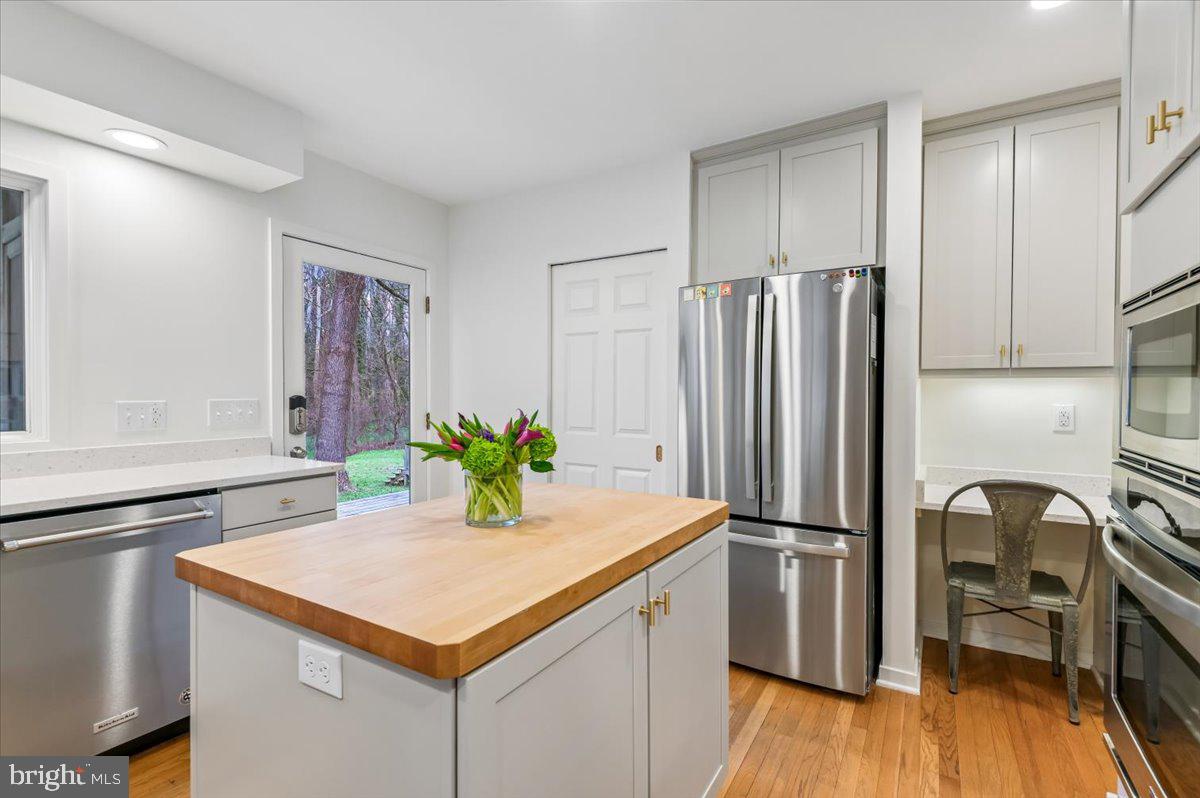 308 West Wind Road Towson, MD 21204 - Photo 19 of 80 a kitchen with a refrigerator a sink and a stove top oven