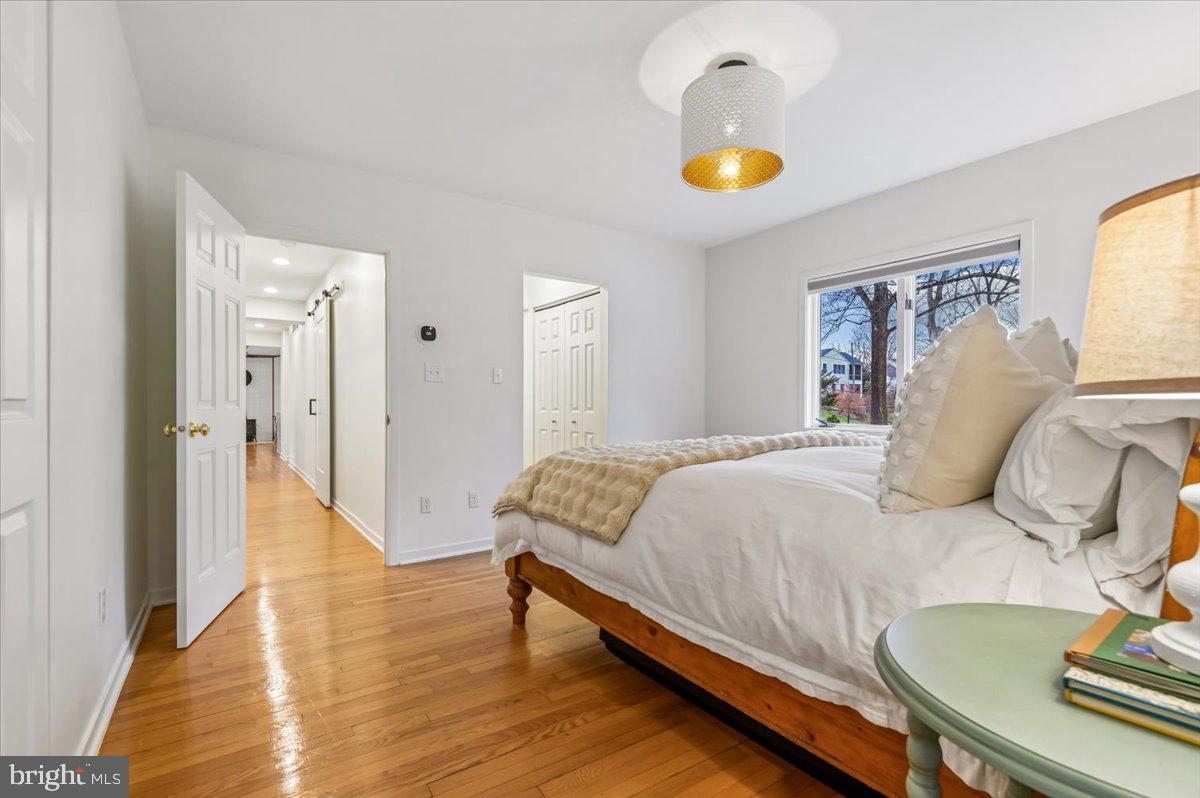 308 West Wind Road Towson, MD 21204 - Photo 27 of 80 a bedroom with a bed and wooden floor
