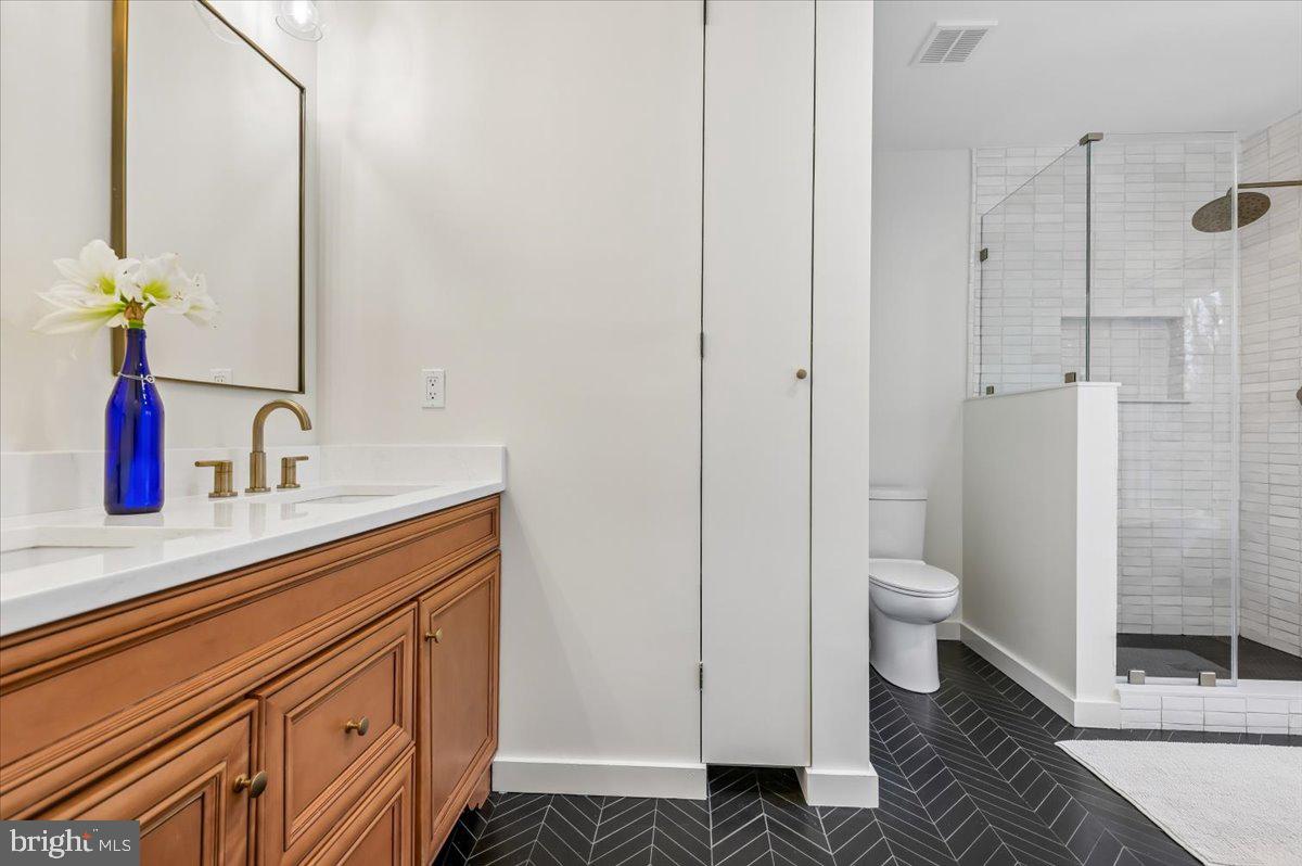 308 West Wind Road Towson, MD 21204 - Photo 31 of 80 a bathroom with a sink toilet and shower
