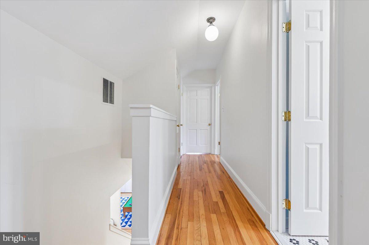308 West Wind Road Towson, MD 21204 - Photo 35 of 80 a view of a hallway with wooden floor