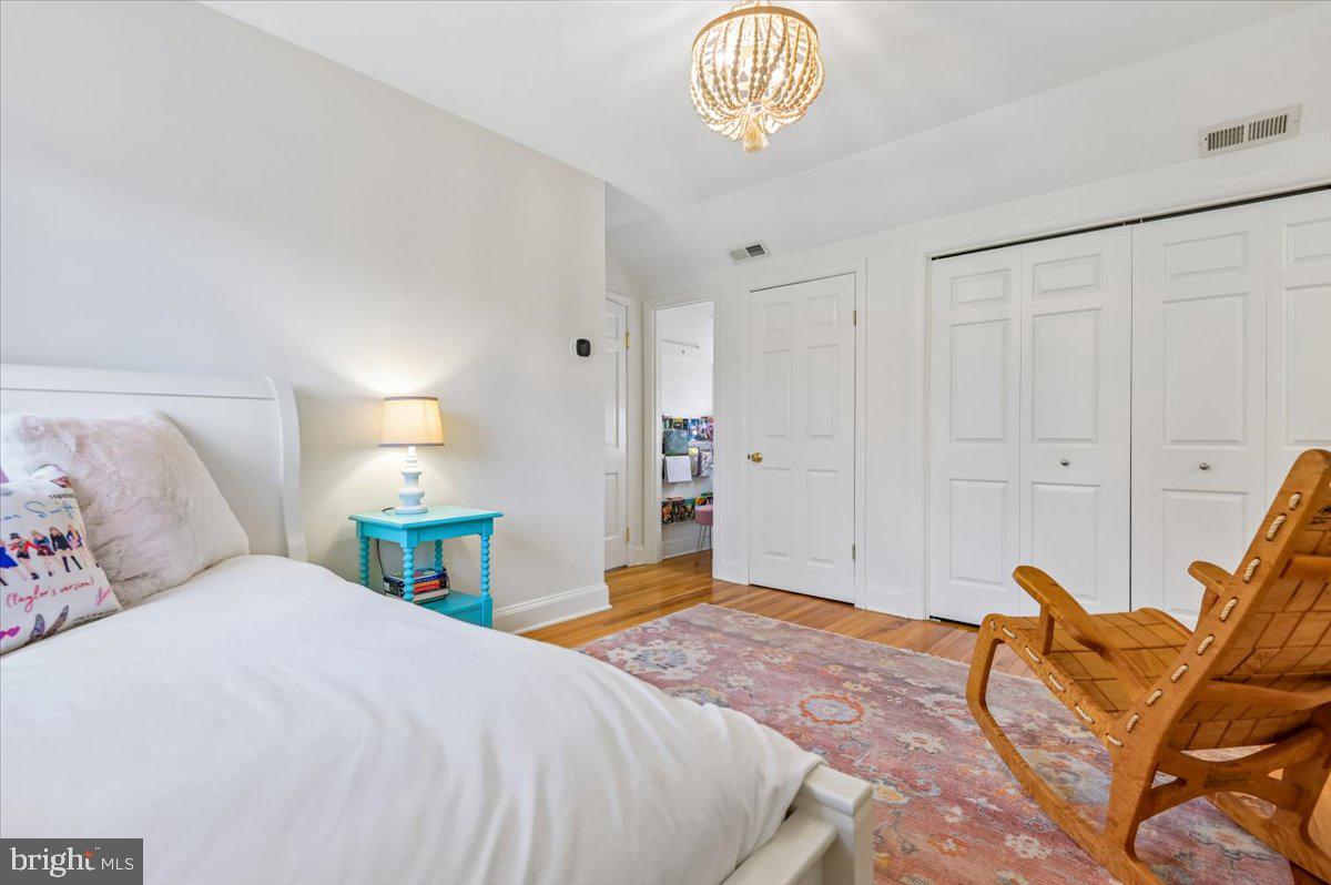 308 West Wind Road Towson, MD 21204 - Photo 43 of 80 a bedroom with a bed and a chandelier