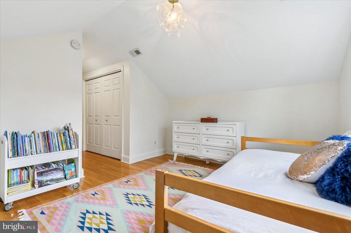 308 West Wind Road Towson, MD 21204 - Photo 46 of 80 a bedroom with a bed and a book shelf