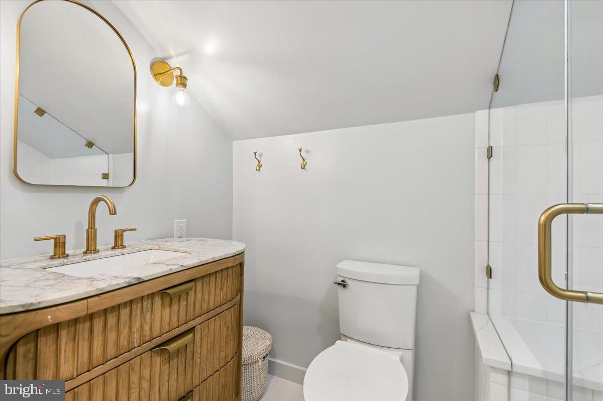 308 West Wind Road Towson, MD 21204 - Photo 47 of 80 a bathroom with a sink a toilet and mirror