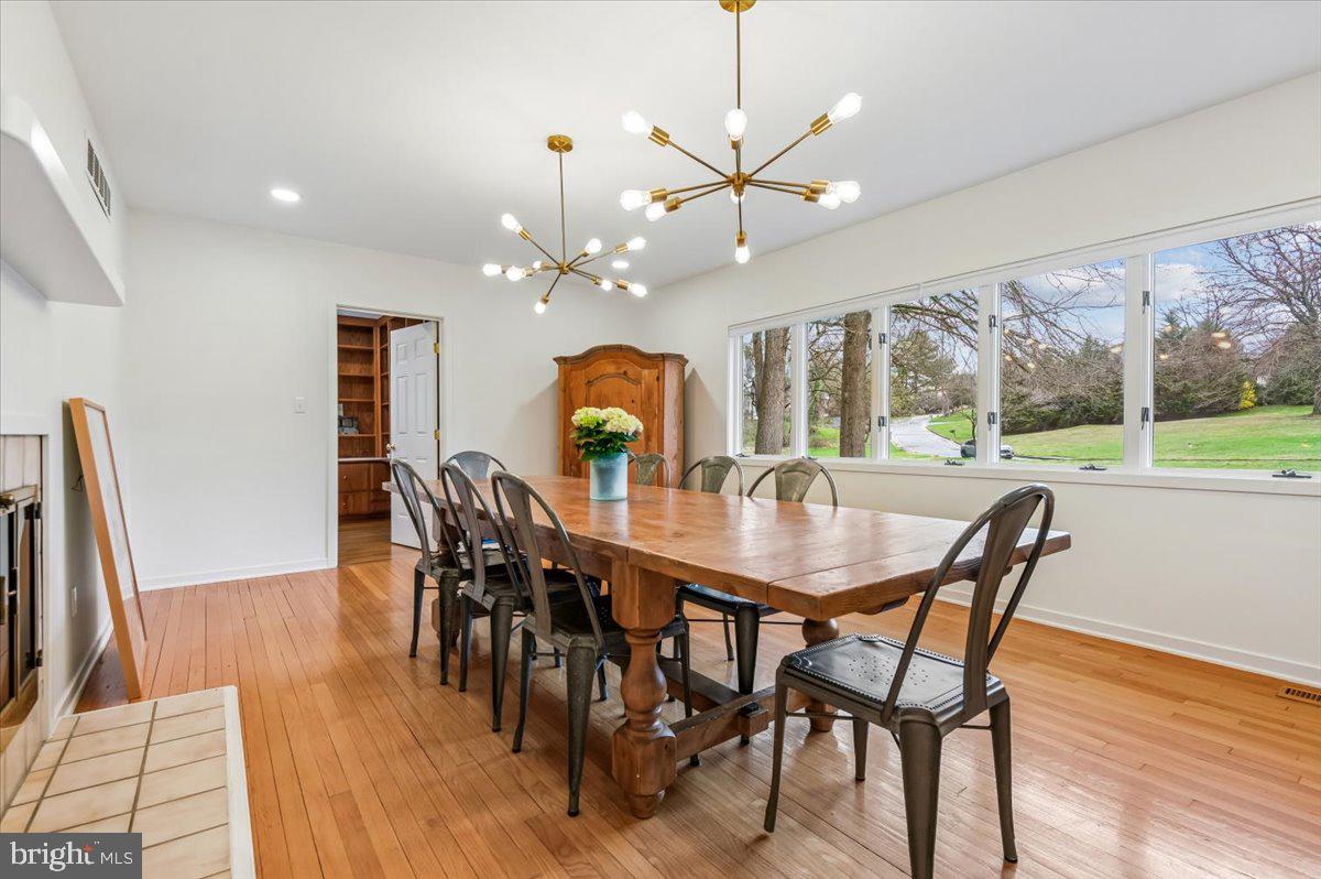 308 West Wind Road Towson, MD 21204 - Photo 4 of 80 a view of a dining room with furniture window and wooden floor