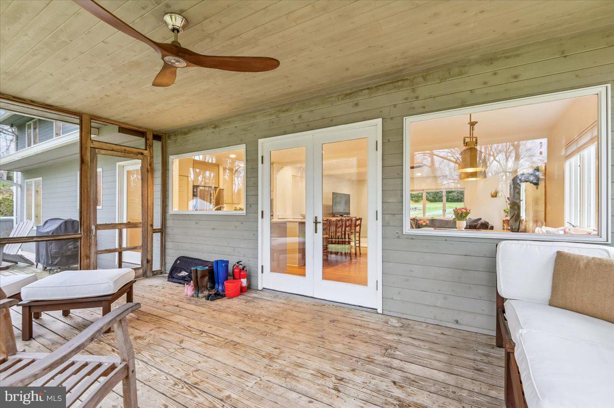 308 West Wind Road Towson, MD 21204 - Photo 60 of 80 a living room with furniture and a floor to ceiling window