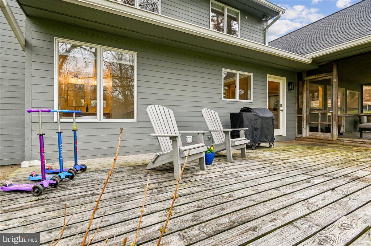 308 West Wind Road Towson, MD 21204 - Photo 61 of 80 a view of a deck with wooden floor and front door