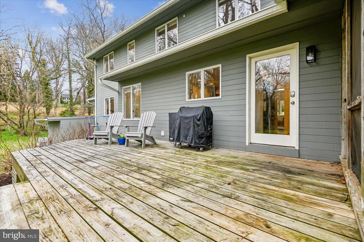 308 West Wind Road Towson, MD 21204 - Photo 62 of 80 a view of a house with a barbeque and wooden stairs