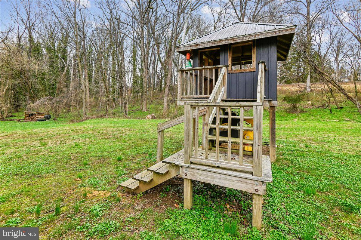 308 West Wind Road Towson, MD 21204 - Photo 75 of 80 a front view of a house with a garden