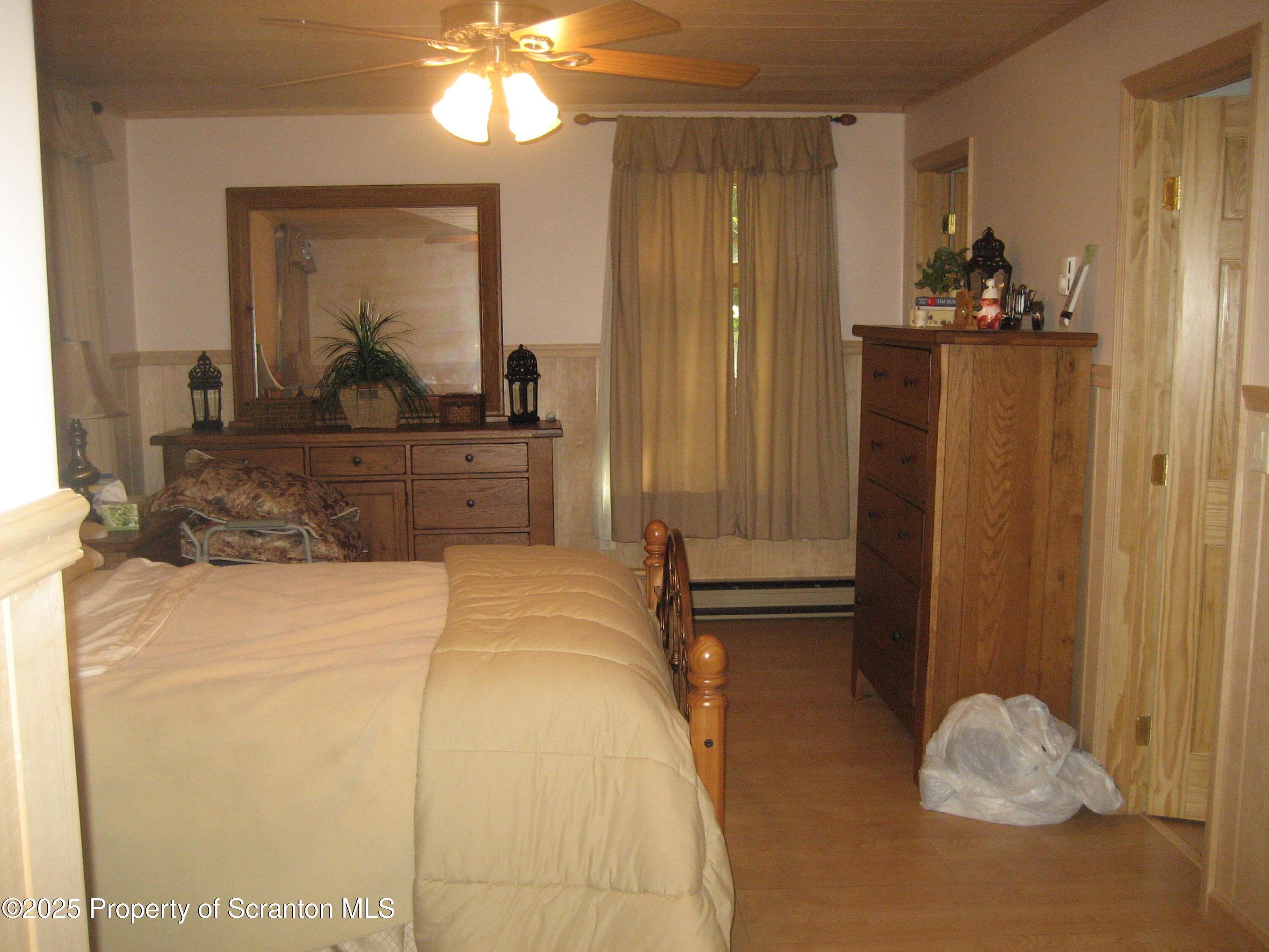 1526 Lakeview Road Susquehanna, PA 18847 - Photo 12 of 31 a bedroom with a bed and a mirror