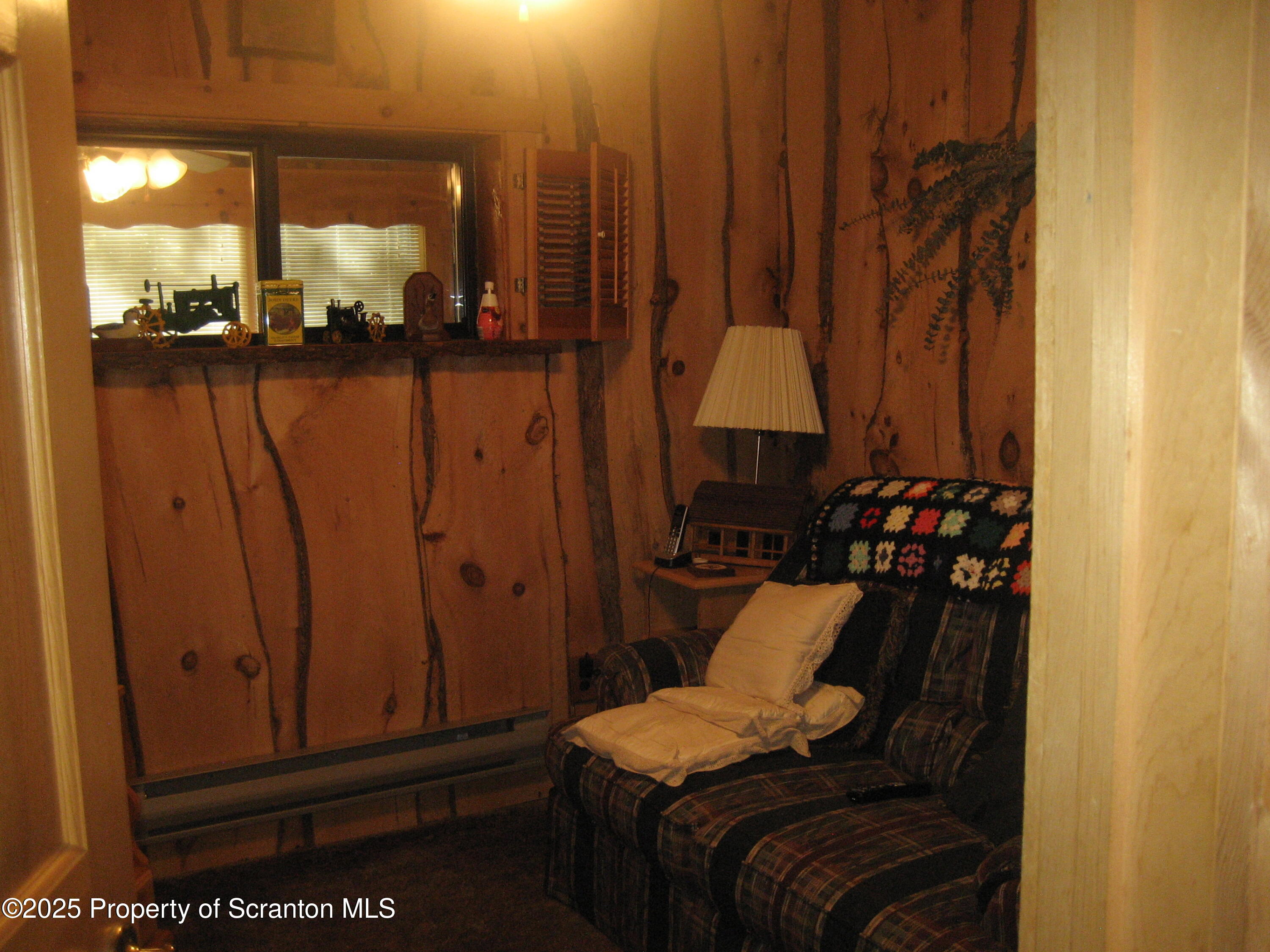 1526 Lakeview Road Susquehanna, PA 18847 - Photo 13 of 31 a view of a balcony with chairs and a potted plant