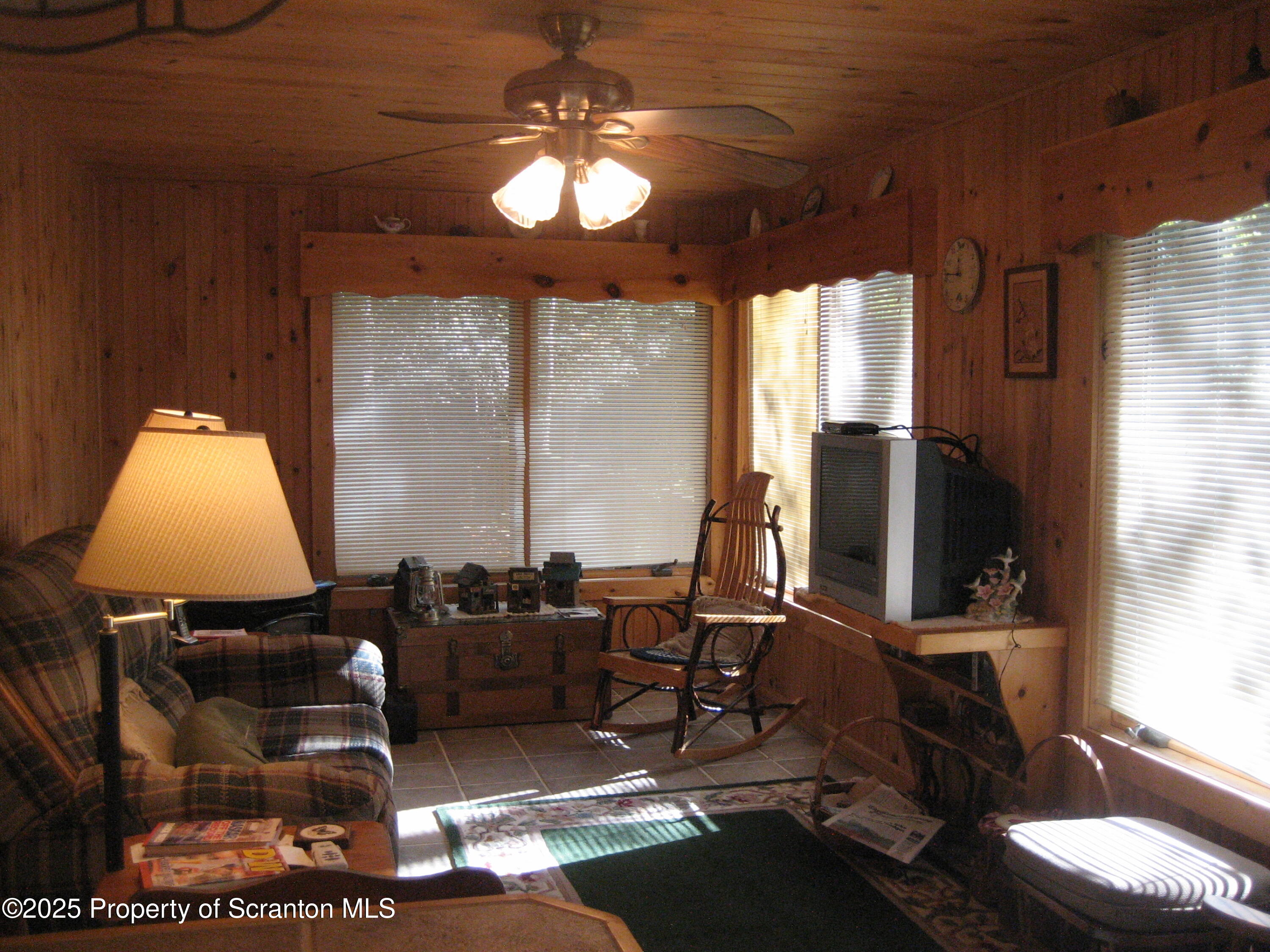 1526 Lakeview Road Susquehanna, PA 18847 - Photo 15 of 31 a room with furniture a flat screen tv and a large window