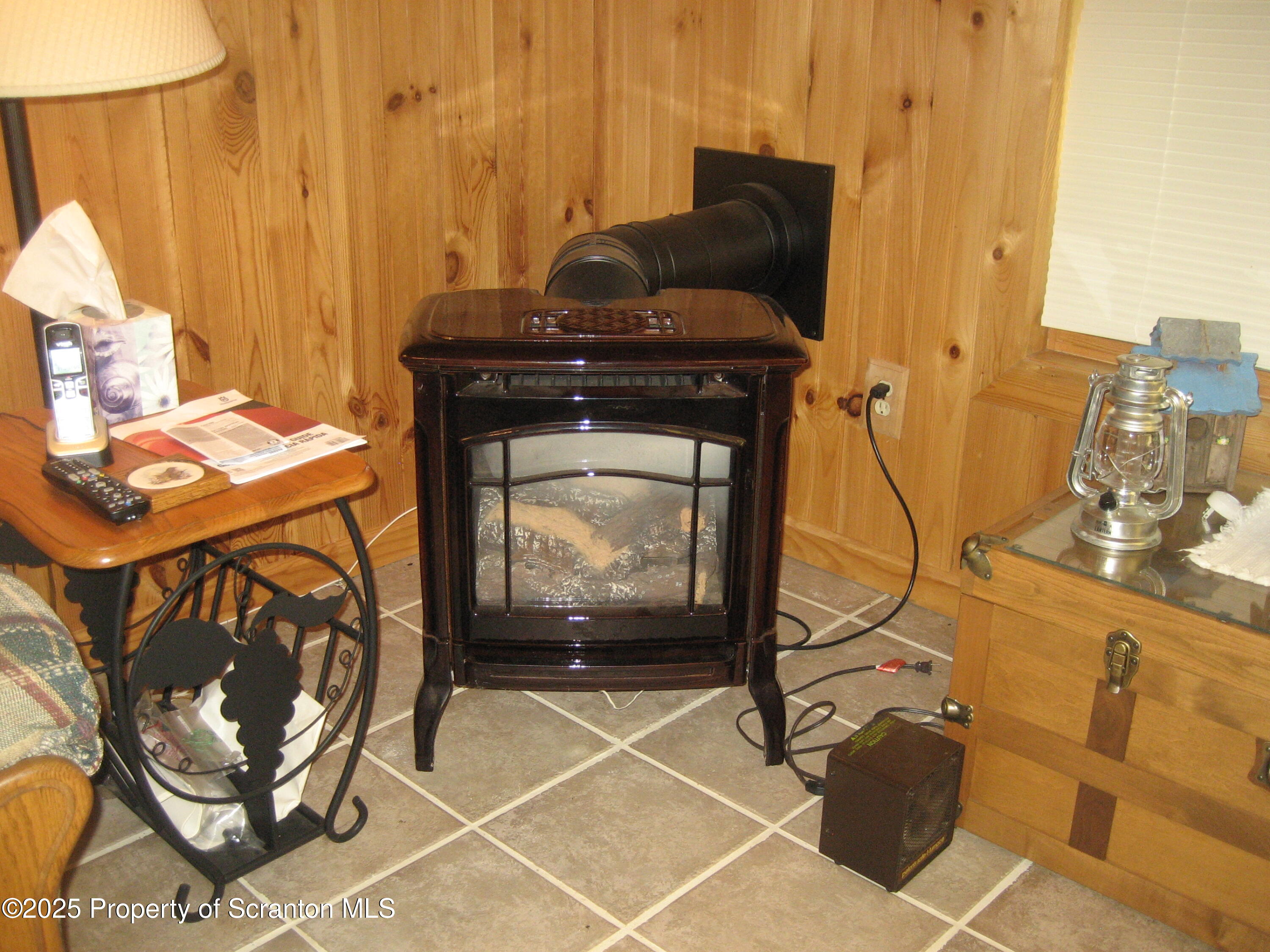 1526 Lakeview Road Susquehanna, PA 18847 - Photo 18 of 31 a living room with a furniture and a fireplace