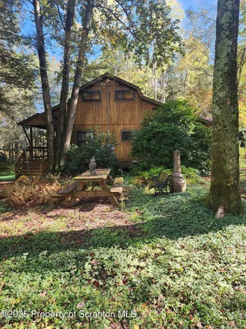 a backyard of a house with lots of green space