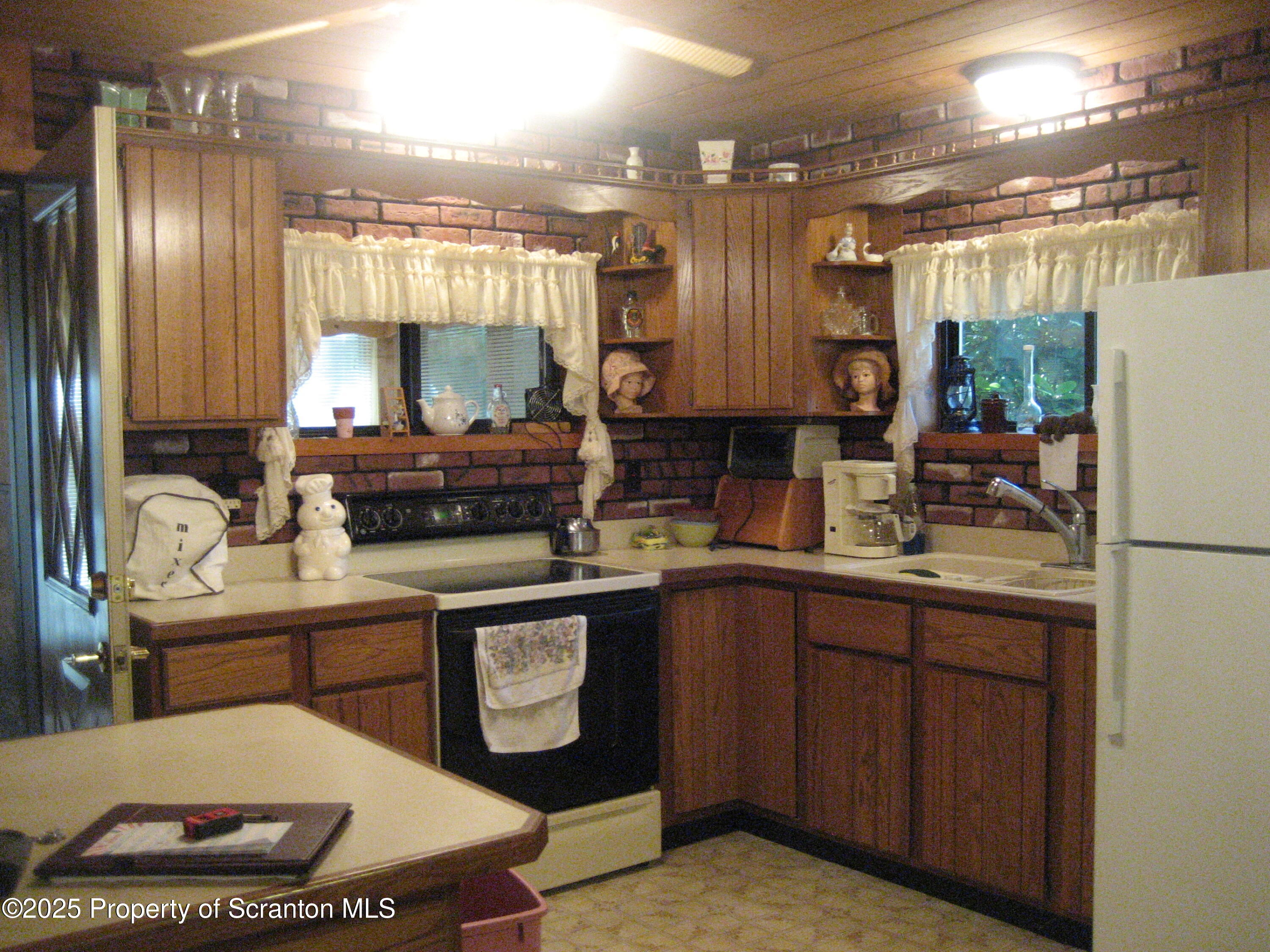 1526 Lakeview Road Susquehanna, PA 18847 - Photo 8 of 31 a kitchen with a sink and cabinets