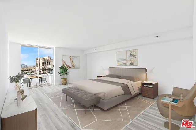 a spacious bedroom with a bed a couch and dresser