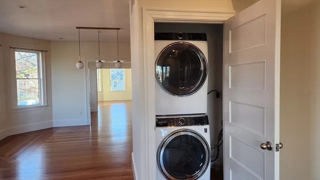 a view of a hallway with washer and dryer