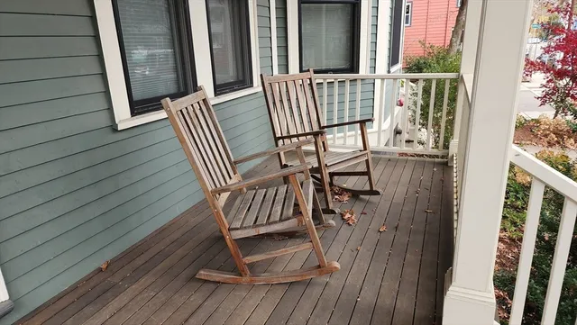 a view of balcony with wooden floor