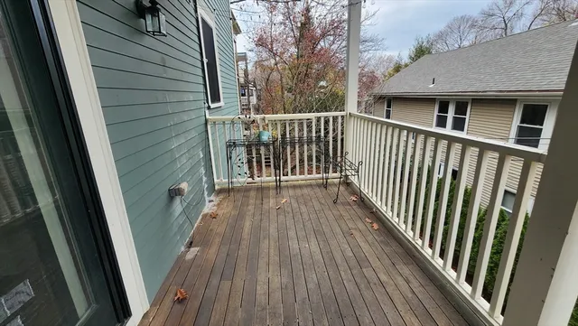 a view of a house with backyard and deck