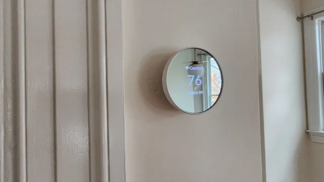 a front view of a house with washer and a mirror