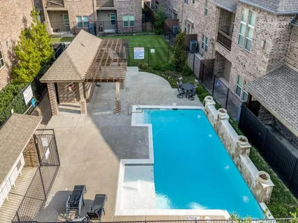 an aerial view of a house with outdoor space