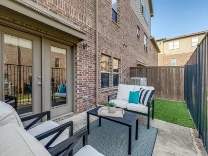 a view of a patio with furniture