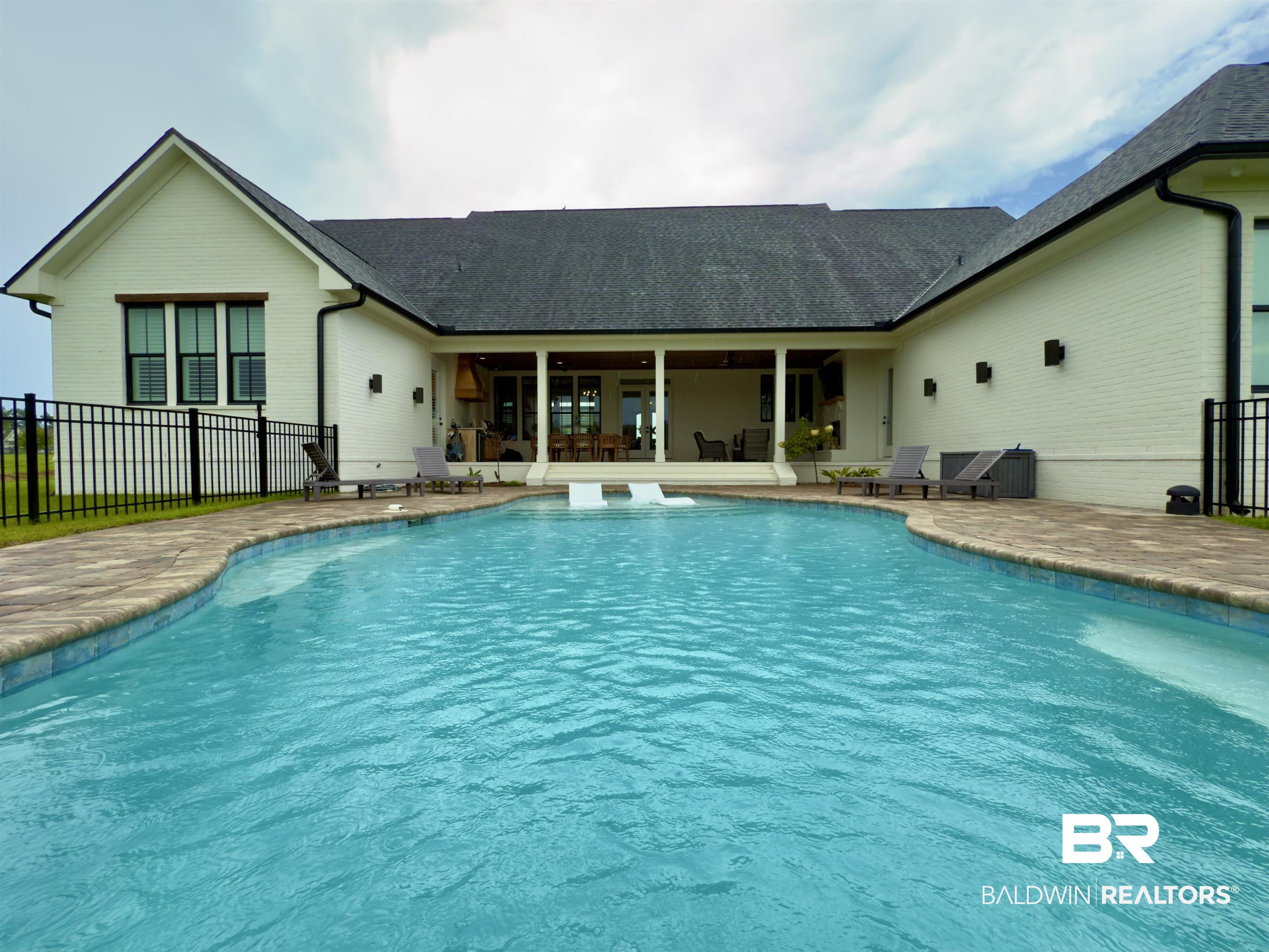 21767 Gallery Boulevard Fairhope, AL 36532 - Photo 67 of 74 Swimming pool featuring a sunroom and a patio area