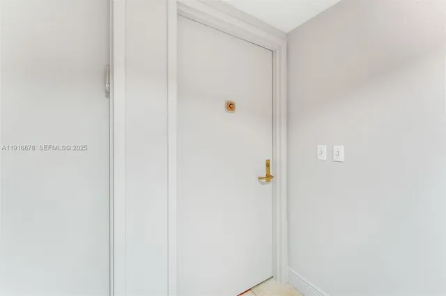 a view of entryway with furniture and a potted plant
