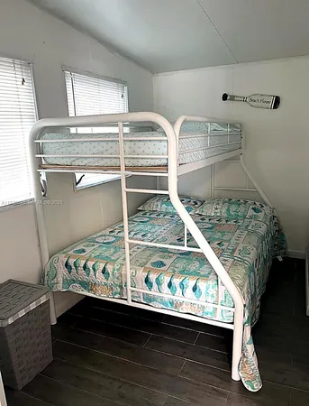 a view of room with wooden floor