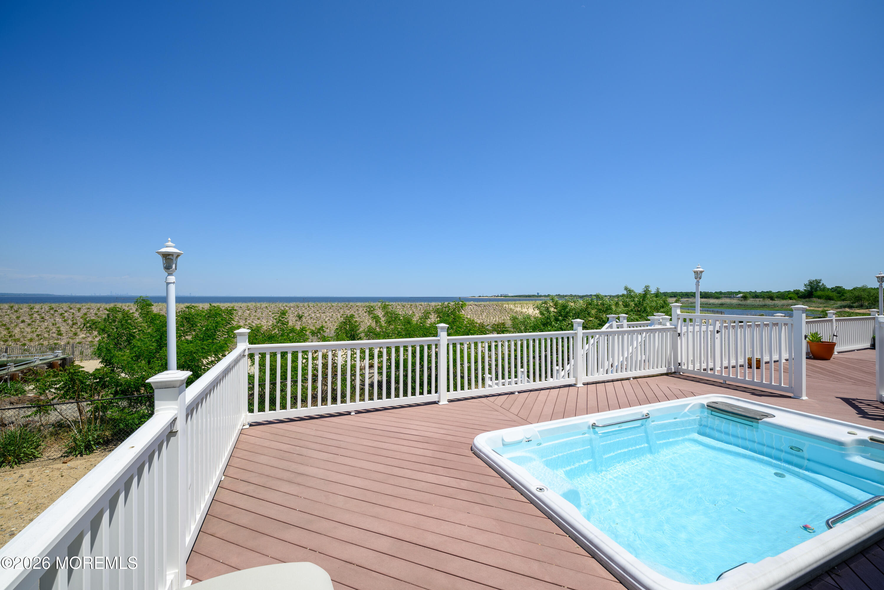 805 Front Street Union Beach, NJ 07735 - Photo 44 of 65 a view of a balcony with floor to ceiling windows with wooden floor