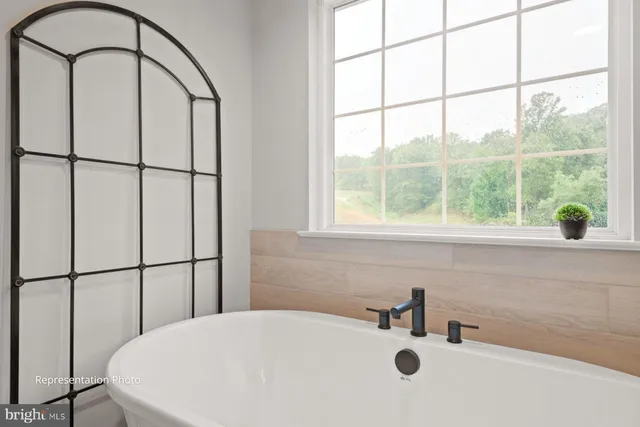 a bathroom with a tub and a sink