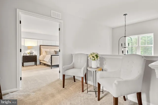 a view of a livingroom with furniture and a window