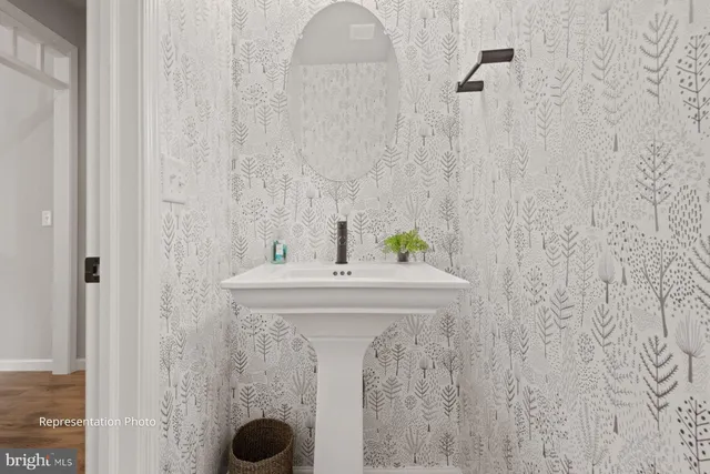 a bathroom with a sink and vanity