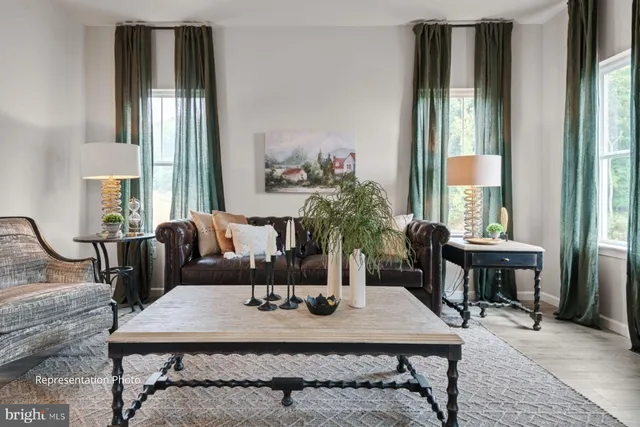 a view of a dining room with furniture and window
